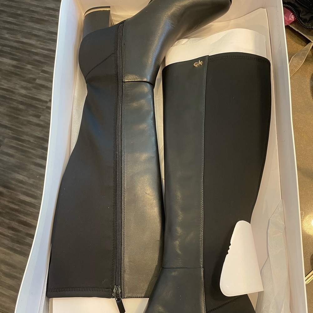 Brand new Calvin Klein size 8 1/2 black knee high boots for sale.